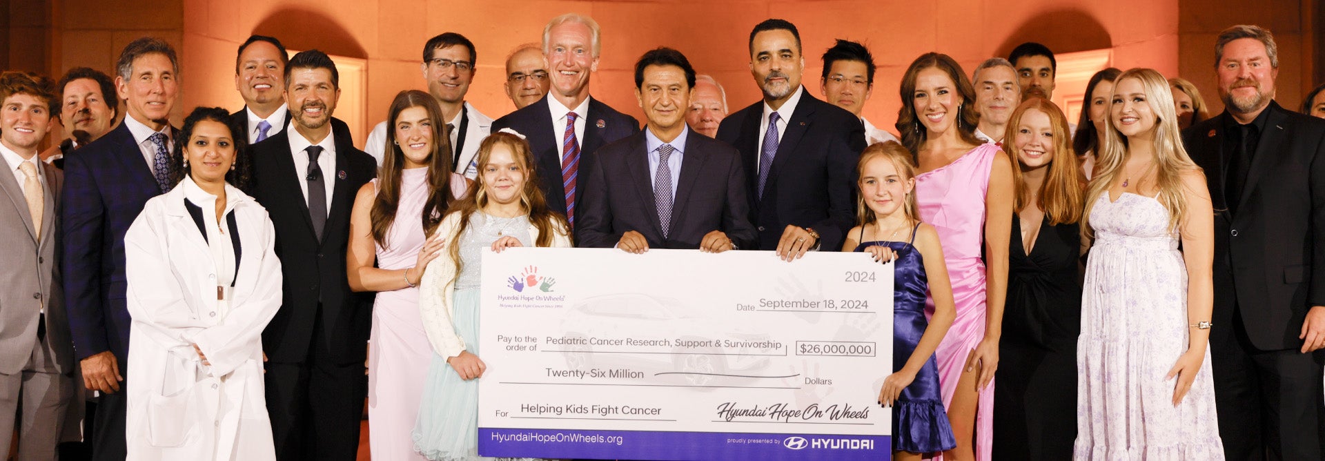 helping kids fight cancer foundation showing their big check from hyundai hope on wheels - Hyundai of Mountain View in Mountain View CA